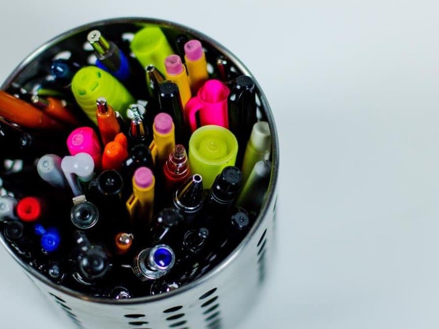 Pot full of pens, markers and highlighters