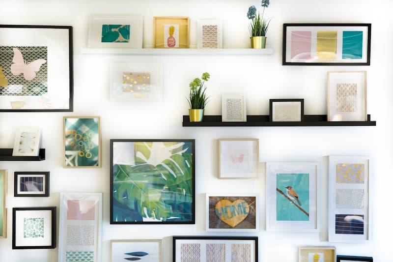 Styled gallery wall of framed prints and art