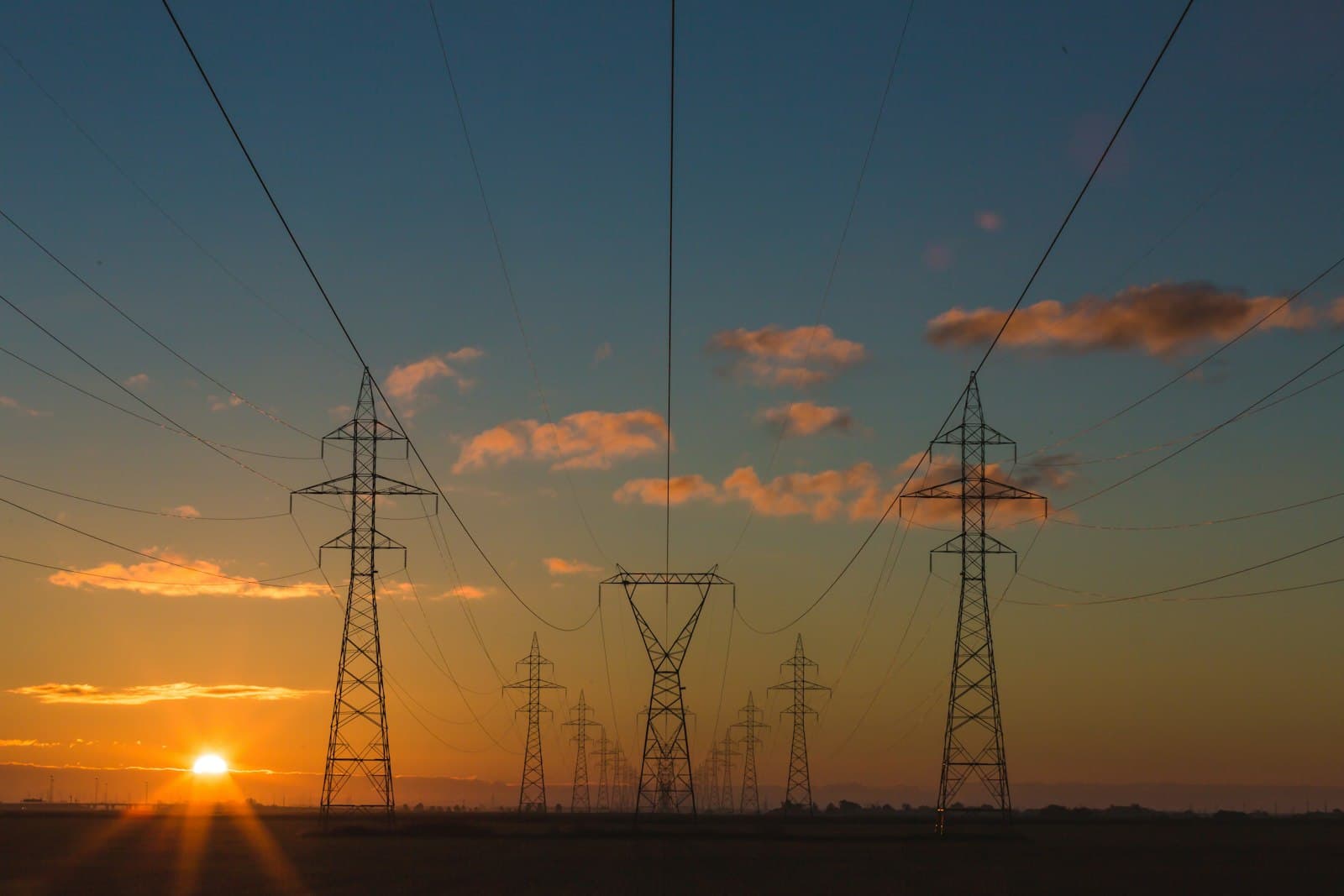 Electricity transmission towers at sunset
