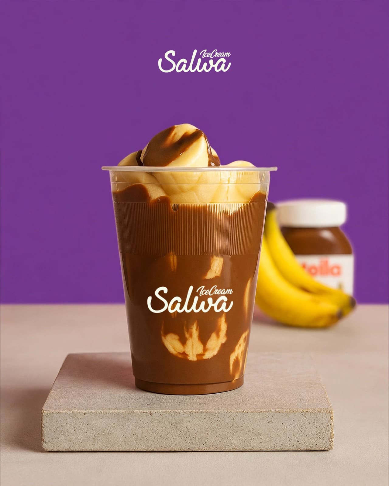 Cup of banana slices layered with chocolate hazelnut spread